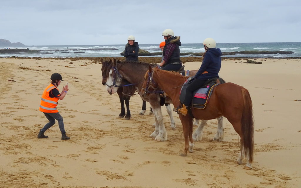 Birthday girls pose with horses on St. Andrews Beach
